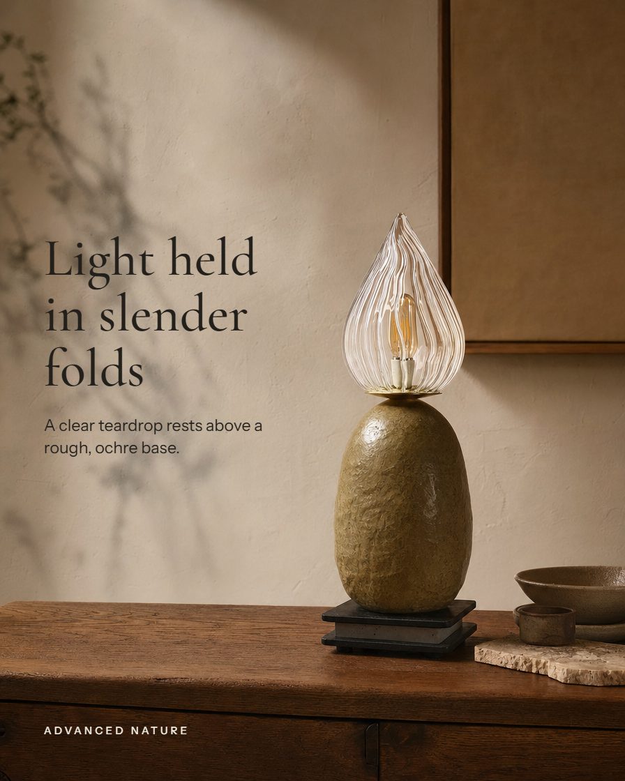 Flame lamp, a glass teardrop on a stone base, headline Light held in slender folds